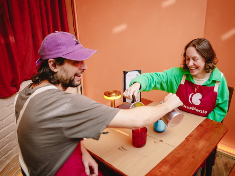 Couple pouring each other's candles